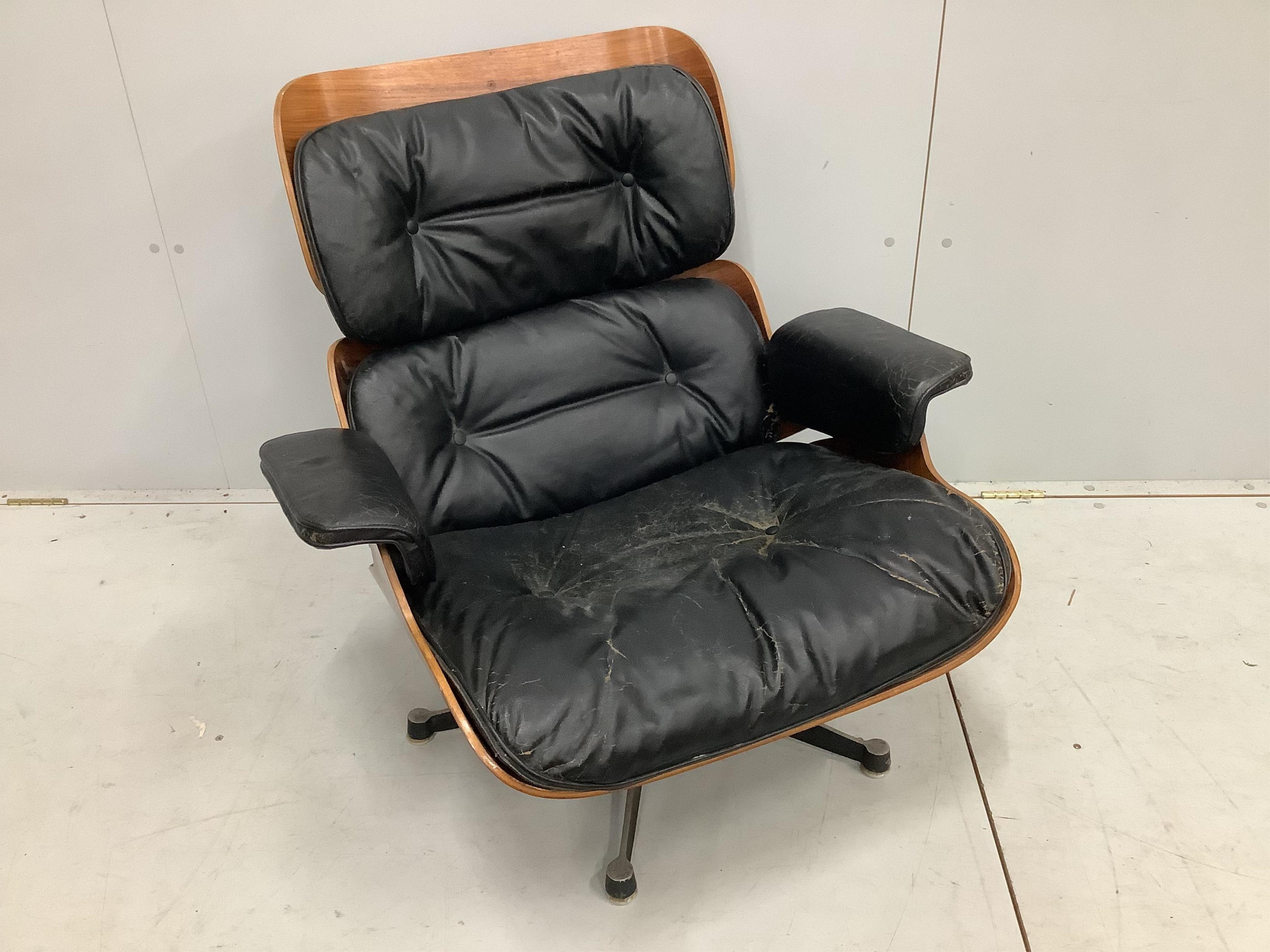 A Charles & Ray Eames for Herman Miller lounge chair, model 670, width 83cm, depth 90cm, height 80cm. Condition - poor